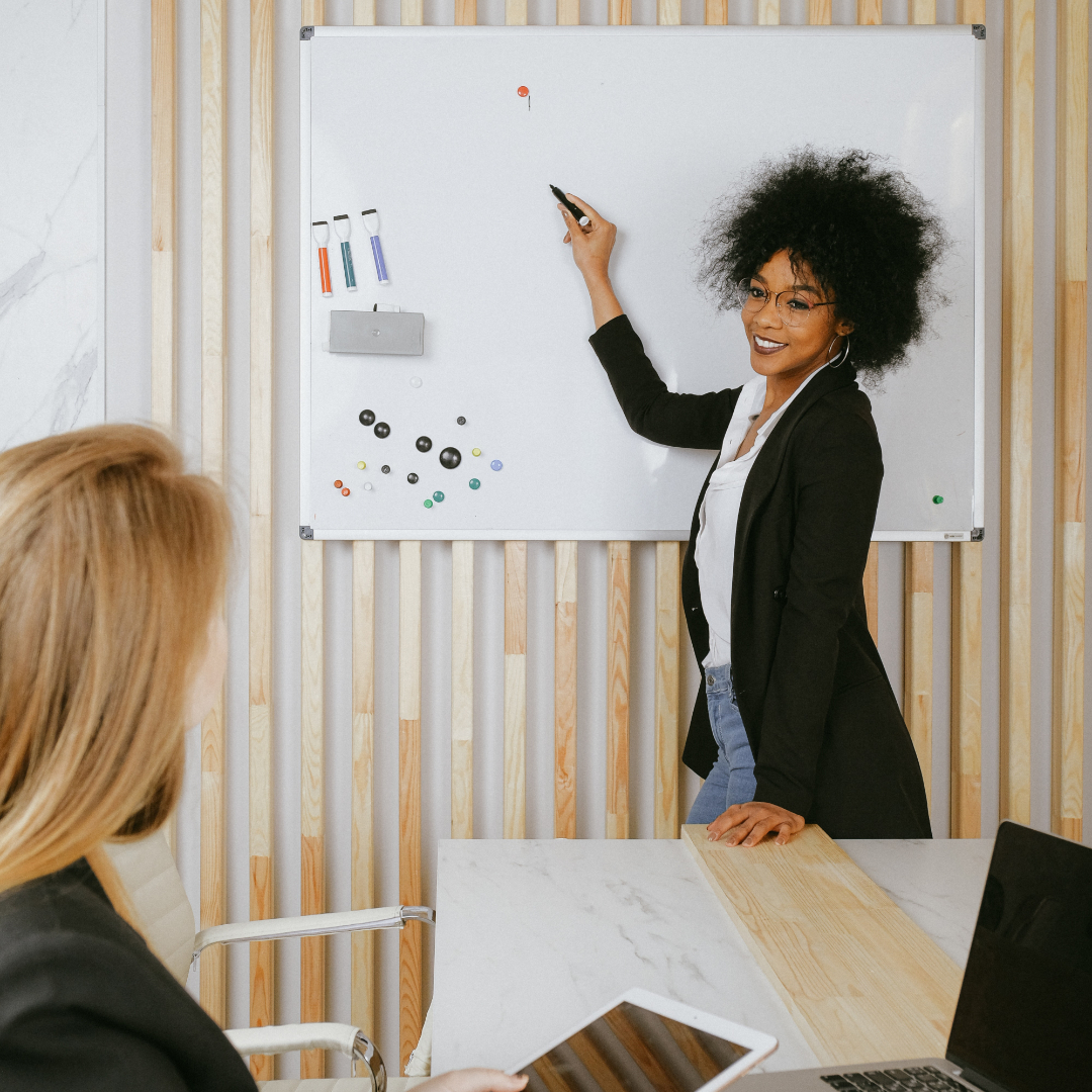 African American Woman leading meeting